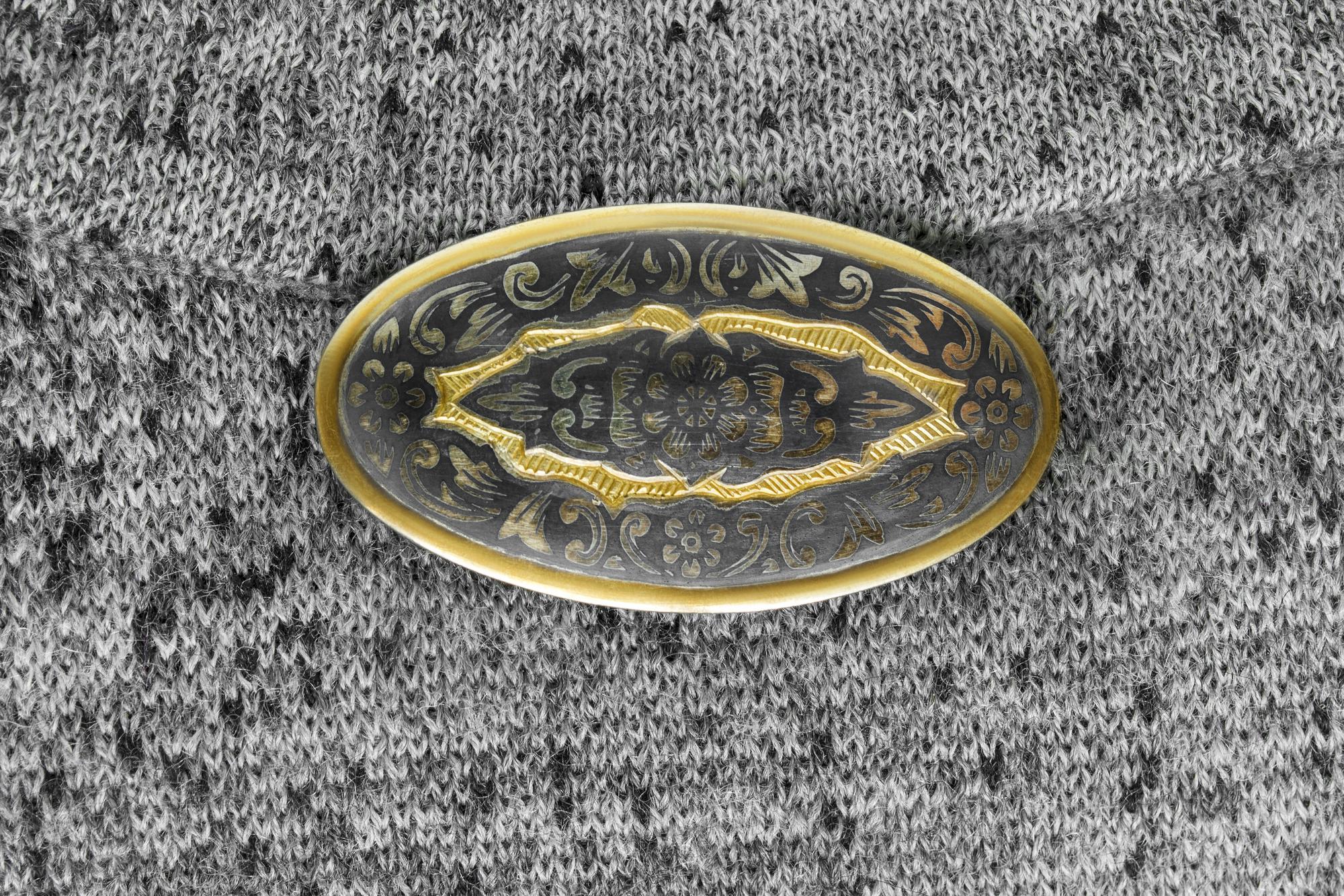 Close-up satin stitch badge