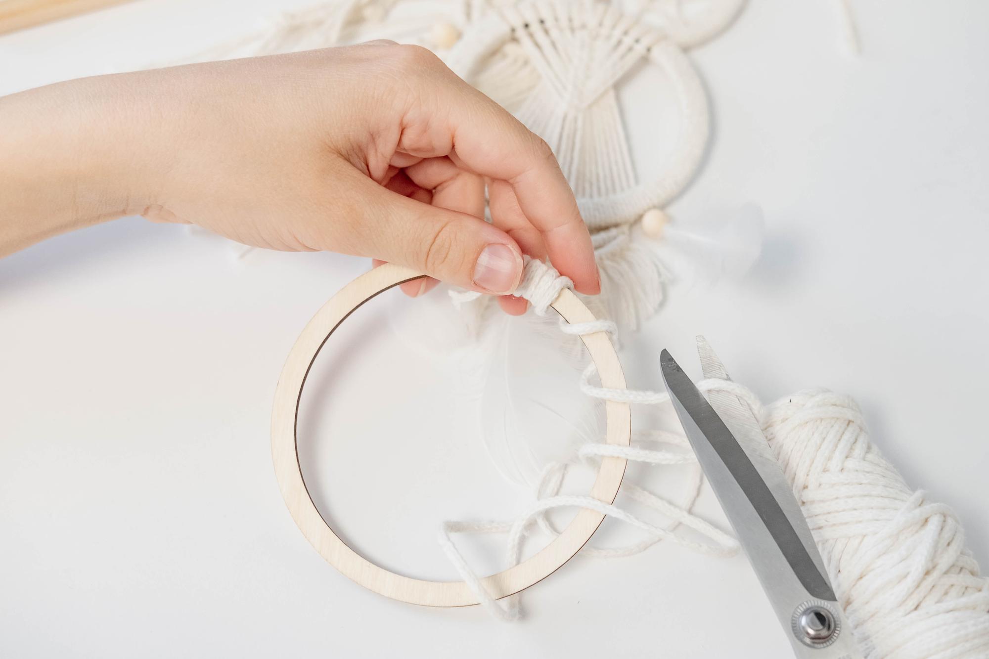 Workshop hands threading hoop
