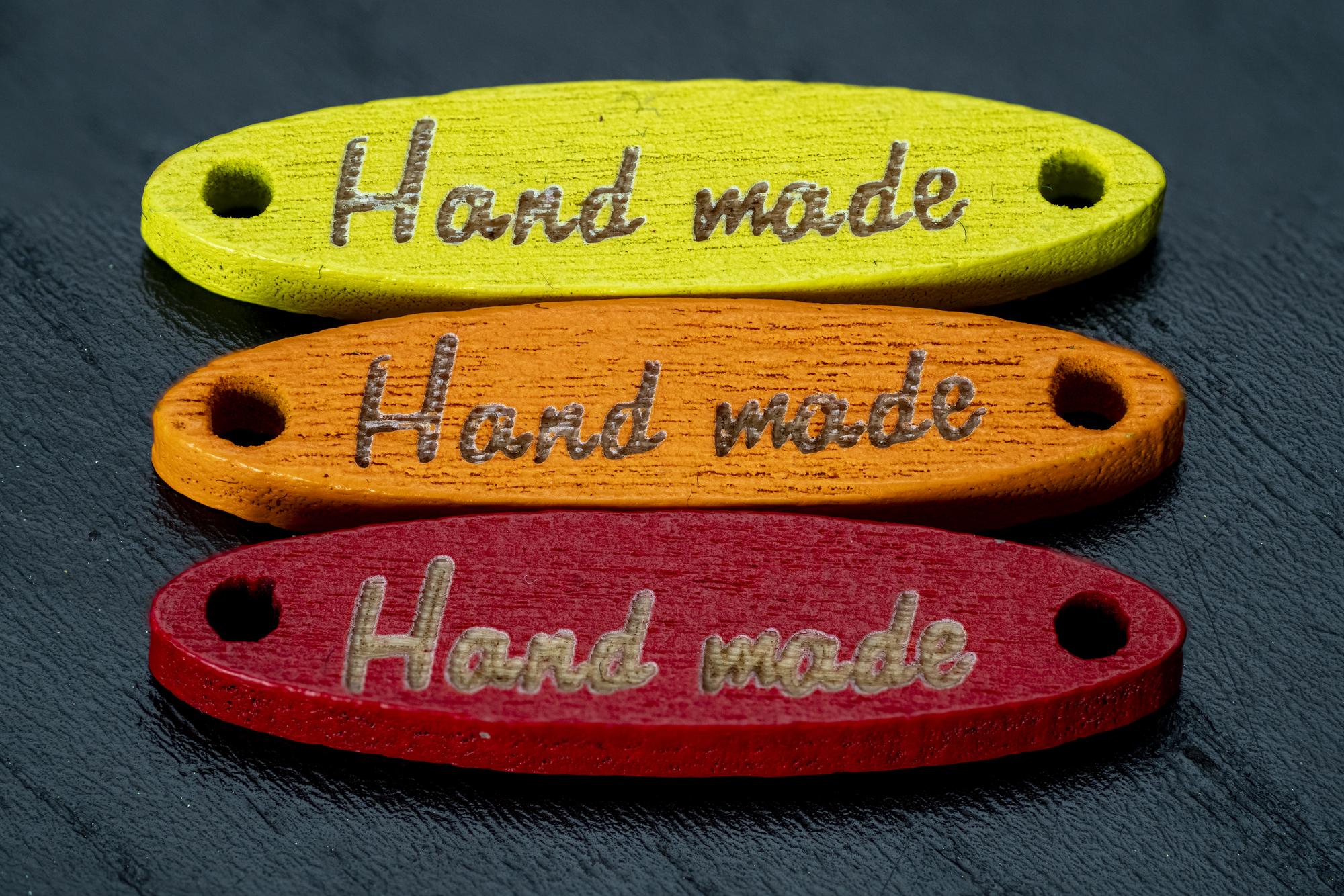 Series of embroidered patches on kraft board