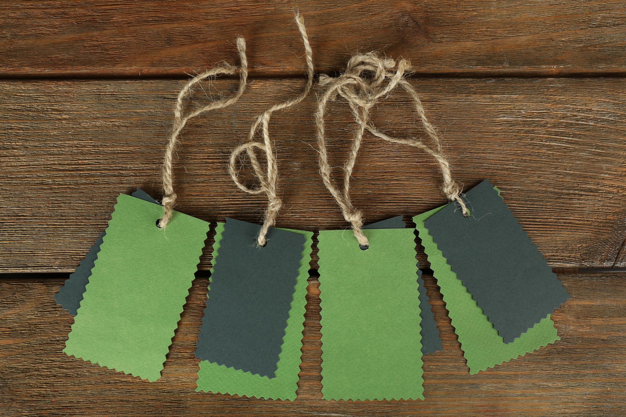 Sample of embroidered labels arranged on table